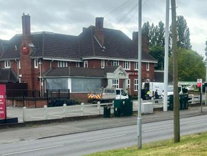 Workmen could be seen boarding up with windows of the pub. Photo: Paddy O'Shea